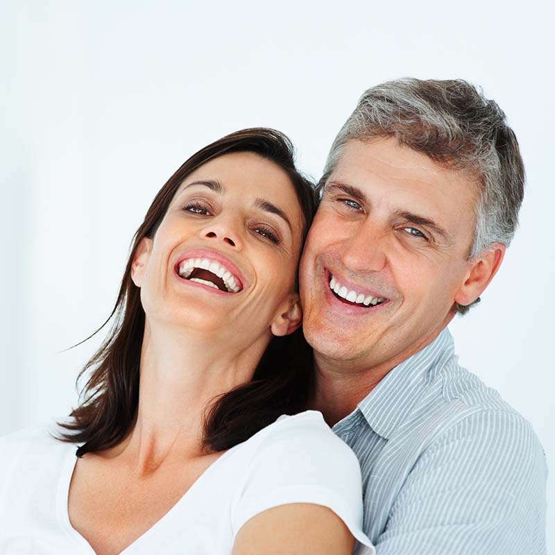 Close-up of a mature couple laughing