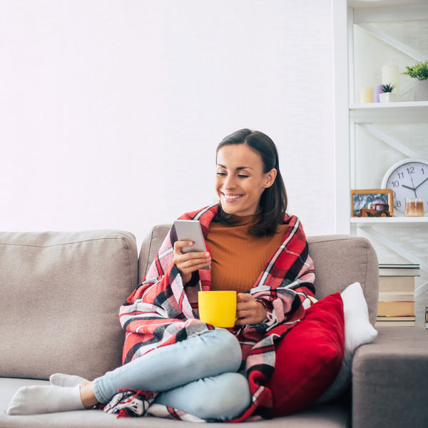 lady on couch with coffee