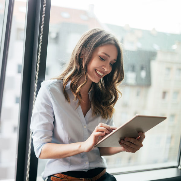 lady smiling at tablet