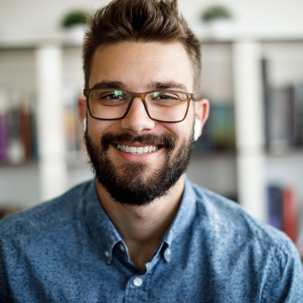 guy with glasses smiling