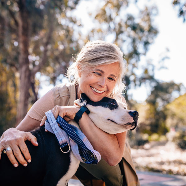 lady with dog smiling