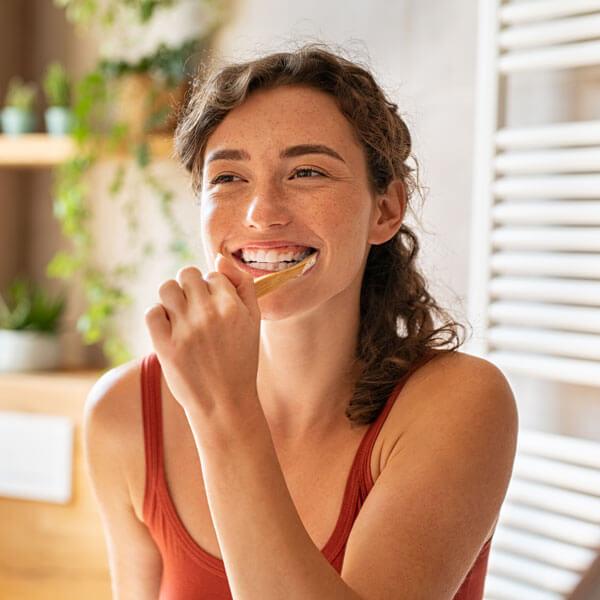 lady smiling with toothbrush