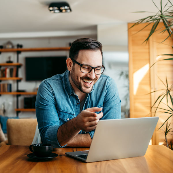 guy smiling at computer