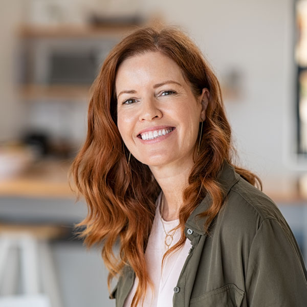 red haired lady smiling