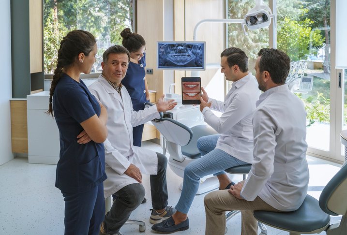 The dental team discussing the treatment plan with the patient in Brecksville & nearby areas