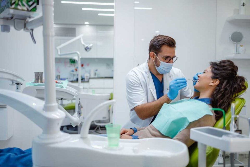 Dentist Performing Routine Oral Health Exam for Cavity Detection and Prevention in Brecksville, OH