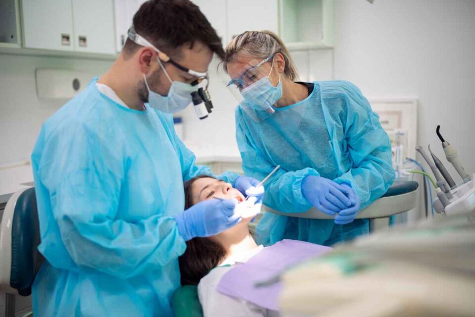 Dentist Performing a Root Canal Procedure on a Patient for Tooth Infection in Brecksville, OH